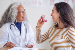 Female doctor administering Asthma care to patient